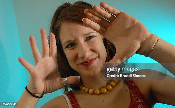 Lindsay Block, who was born missing the lower part of her left arm, demonstrates her new i-LIMB hand, here covered in a lifelike skin glove,...