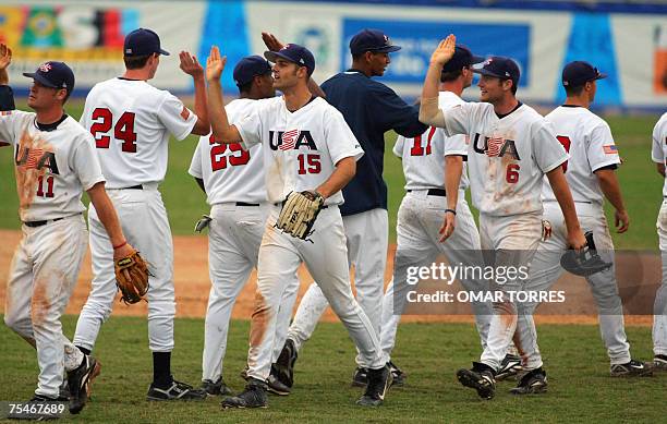 Rio de Janeiro, BRAZIL: US players celebrate at the end of the semifinal baseball game against Mexico, 18 July 2007, at the Cidade do Rock stadium,...