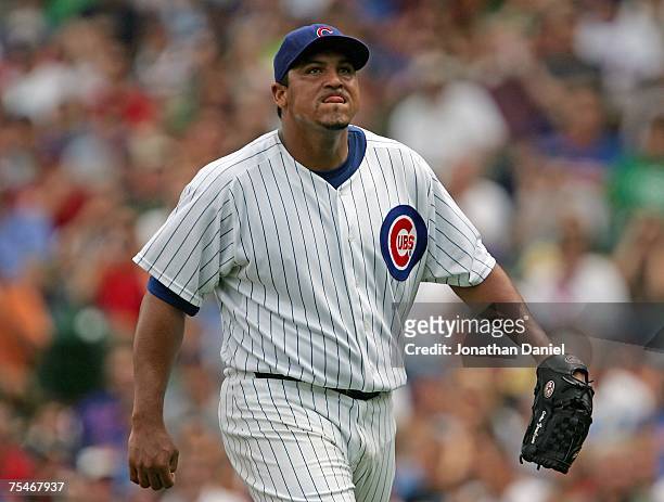 Starting pitcher Carlos Zambrano of the Chicago Cubs reacts after striking out the side in the 3rd inning against the San Francisco Giants on July...