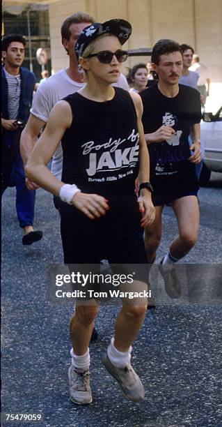 Madonna at The Mayfair Hotel jogging with bodyguards in London, United Kingdom.