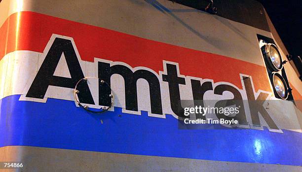 An Amtrak logo is seen February 4, 2002 on the front of locomotive parked at the Union Station in Chicago, IL. Amtrak said on February 1, 2002 that...