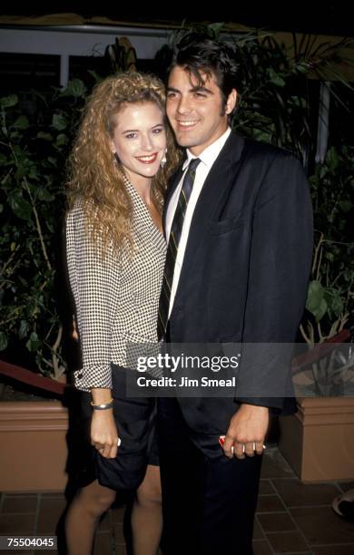 Kelly Preston and George Clooney at the AMC Century 14 Theater in Los Angeles, California