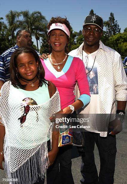 Whitney Houston , daughter Bobbi Kristina and Bobby Brown at the Downtown Disney Theatre in Anaheim, California