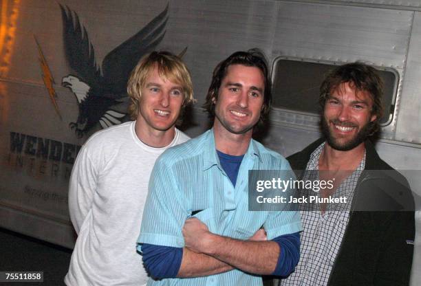Actors Andrew Wilson, Luke Wilson, and Owen Wilson, r-l, stand by a trailer used in their new movie 'The Wendell Baker Story' during the Wilson...