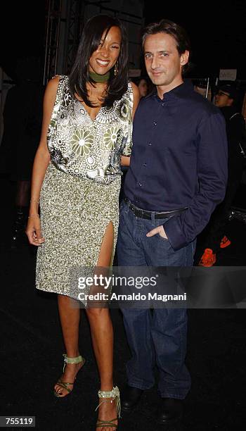 Cynthia Garret and designer Luca pose at the Luca Luca Fashion Show February 12, 2002 in New York City.