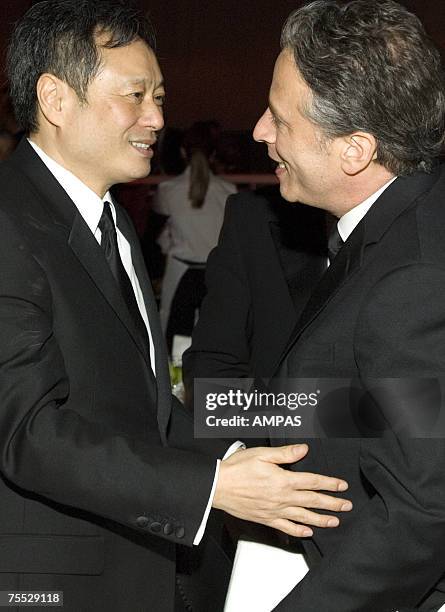 Best Director Academy Award winner Ang Lee greets Academy Awards host Jon Stewart at the Governors Ball after the 78th Annual Academy Awards at the...