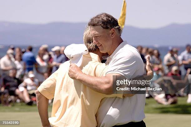 Winner Chris Chandler hugs Jack Wagner at the American Century Celebrity Golf Tournament on July 15, 2007 at the Edgewood Tahoe Golf Course in Lake...