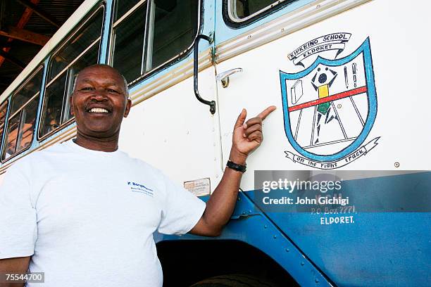 School founder Kip Keino poses for a portrait by the school bus at his primary school on February 19, 2007 in Eldoret, Kenya.