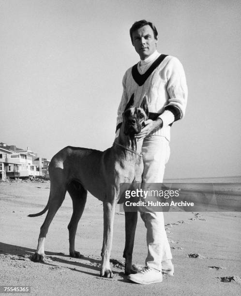 American actor Adam West, best known for his TV role as Batman, with a great dane he calls 'Batdog', circa 1967.
