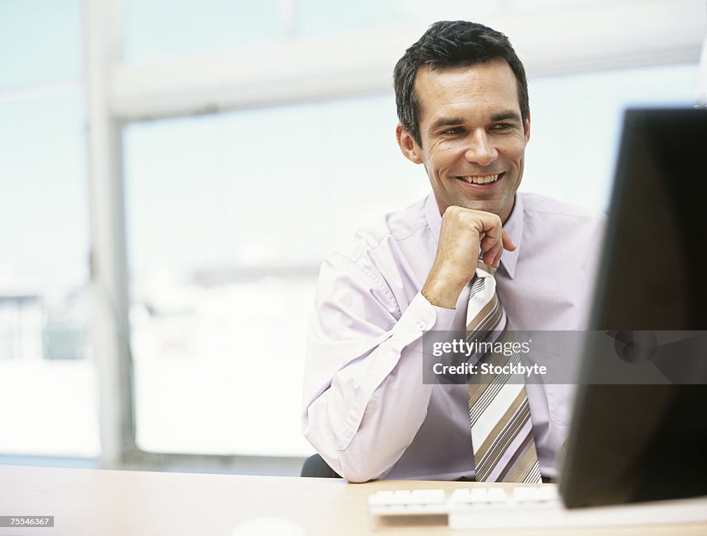 Business man using computer,upper half