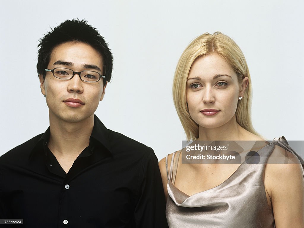 Well-dressed young man and woman,head and shoulders