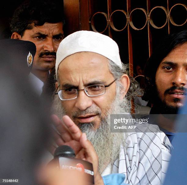 Detained Pakistani chief cleric of Islamabad's Red Mosque Abdul Aziz leaves an anti-terrorist court after his hearing in Rawalpindi, 19 July 2007....