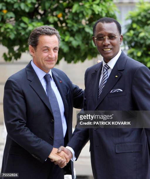 French President Nicolas Sarkozy shakes hands with his Chadian counterpart Idriss Deby Itno before talks focused on Darfur crisis at the presidential...