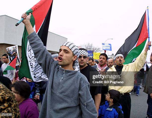 Hundreds of demonstrators march to protest Israeli treatment of Palestinians April 1, 2002 in Dearborn, MI. With 300,000 Arab-Americans in the...