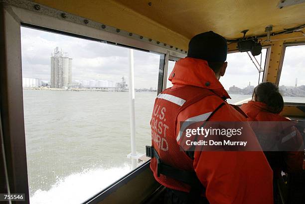 Members of the U.S. Coast Guard patrol the waters around Port Elizabeth April 1, 2002 near New Jersey. The Coast Guard and 21 other agencies are...