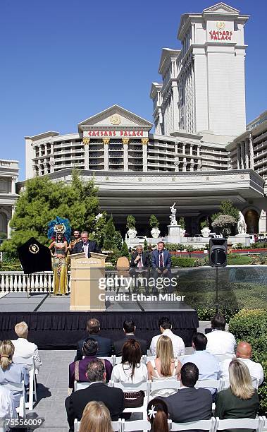 Harrah's Entertainment, Inc. Western Division Tom Jenkin speaks as Roman characters Cleopatra and Julius Caesar, Caesars Palace President Gary...