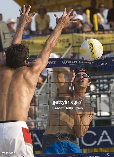 Todd Rogers tries to get the ball past Mike Lambert during men's finals in the AVP Seaside Heights Open at Seaside Heights Beach on July 8, 2007 in...