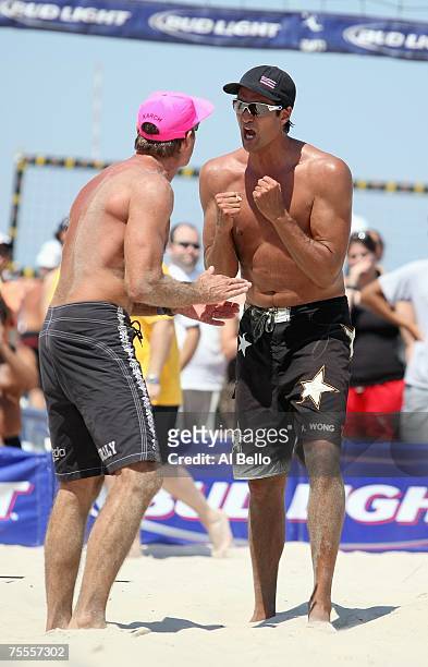 Karch Kiraly celebrates the point with Kevin Wong during at the AVP Seaside Heights Open on July 7, 2007 at Seaside Heights Beach in Seaside Heights,...