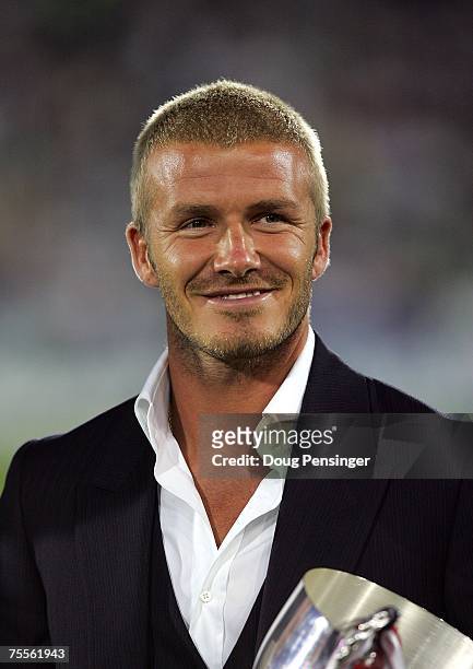 David Beckham of the Los Angeles Galaxy acknkowledges the fans prior to presenting U-17 MLS Youth Cup trophy to D.C. United at the half of the 2007...