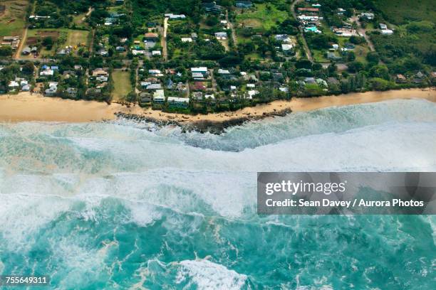 aerial view of rocky point under surf called condition black, oahu, hawaii, usa - black point surf stock pictures, royalty-free photos & images