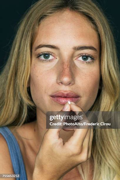 young woman preparing to take pill - contraceptive pill stock pictures, royalty-free photos & images