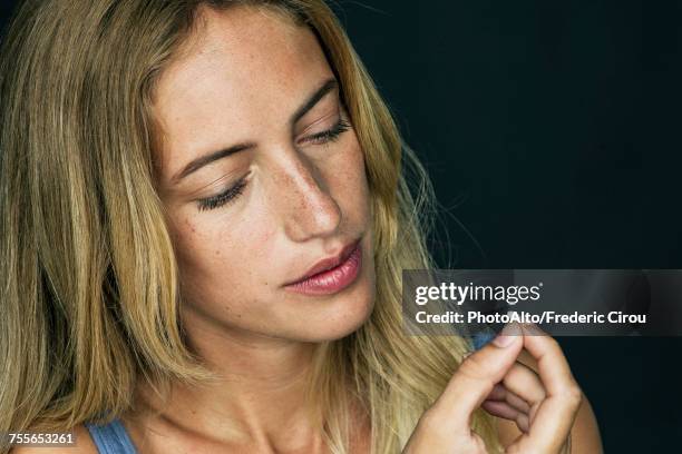 young woman preparing to take pill - birth control pill stock pictures, royalty-free photos & images