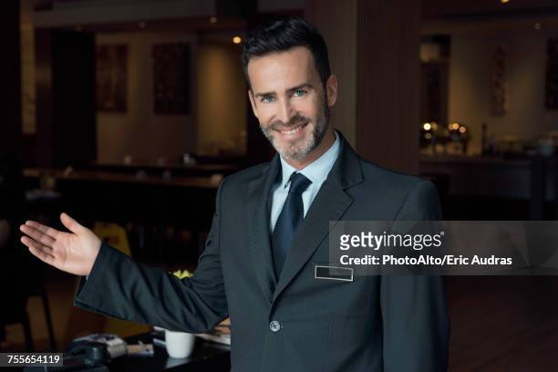 restaurant maitre d greeting customers - concierge ストックフォトと画像