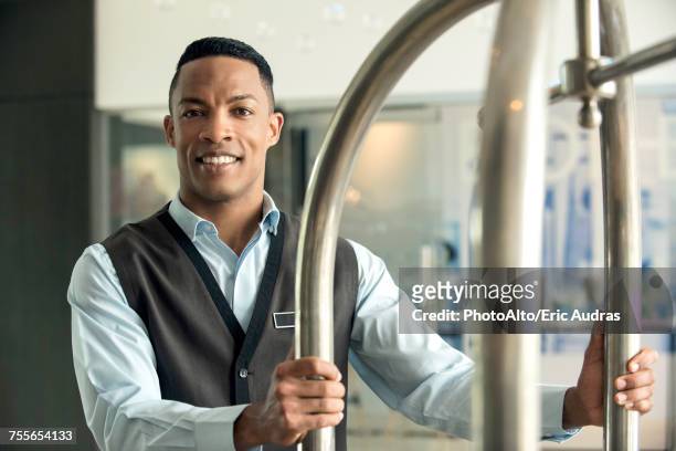 bellhop at hotel - bell boy stock pictures, royalty-free photos & images