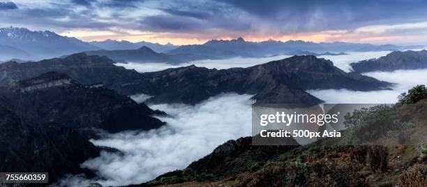 mountain range shrouded in clouds, sichuan, china - mount gongga stock pictures, royalty-free photos & images