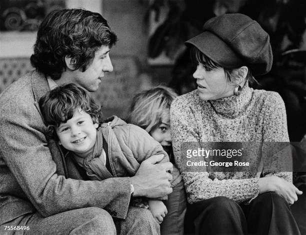 Academy Award-winning actress Jane Fonda poses on the veranda of her home with husband Tom Hayden, son Troy Garity, and daughter Vanessa Vadim in...