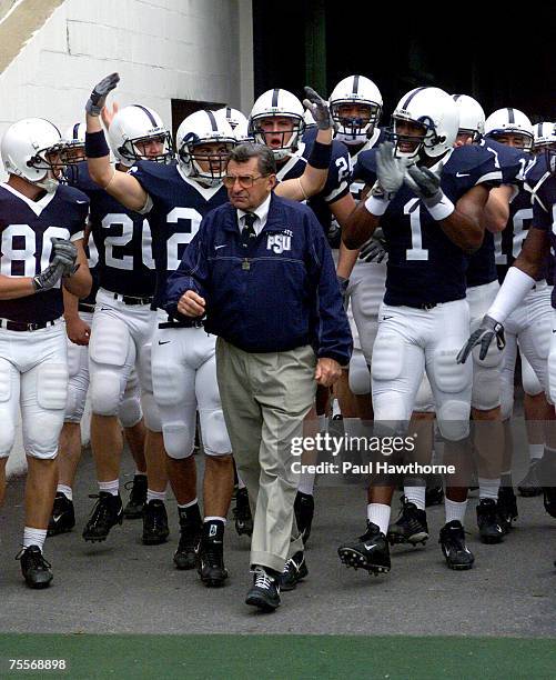 Penn State head coach Joe Paterno enters the field with his team at the start of the game with Ohio State at Beaver Stadium, University Park,...