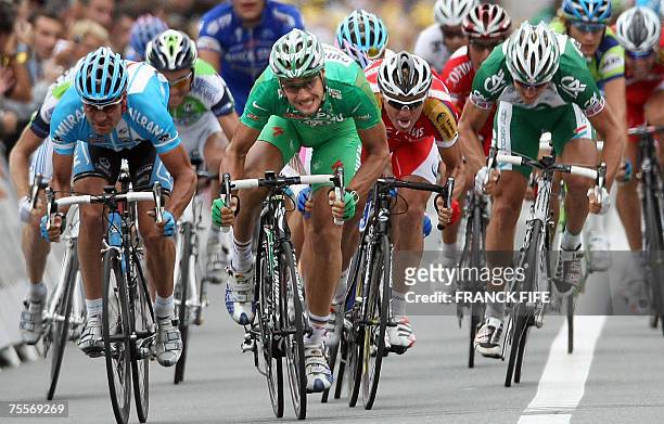 Germany?s Erik Zabel , Belgium?s Tom Boonen and South Africa?s Robert Hunter sprint towards the finish line of the 12th stage of the 94th Tour de...