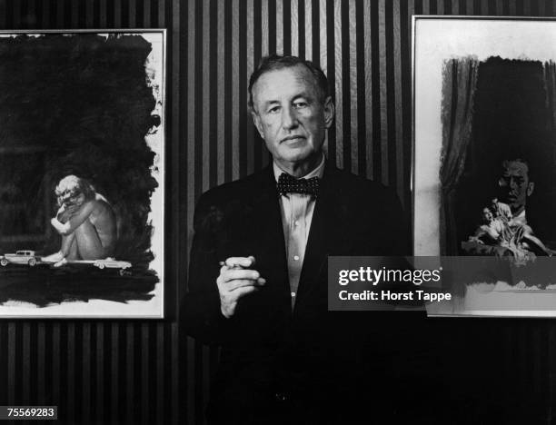 British author and creator of James Bond Ian Fleming with two pieces of original artwork from the American hardback editions of his books, circa 1960.