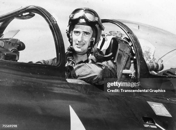 Ted Williams is photographed in the cockpit of his fighter jet in an unknown location during the Korean War in 1952.