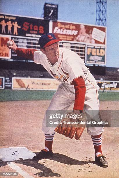 Red Schoendienst, second baseman for the St. Louis Cardinals, is about to make a throw from third base during a photo session at Sportsmans Park in...