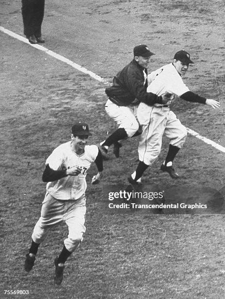 Bobby Thomson has just rounded third base, on his way to scoring the winning run after hitting a home run in a playoff game for the National League...