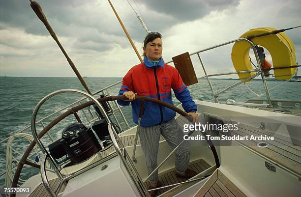 British yachtswoman Tracy Edwards at the helm, 1990. In 1989 she captained the first all-female crew to sail around the globe.