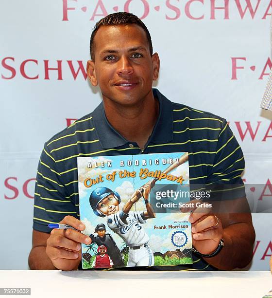 New York Yankee Alex Rodriguez poses for a photo following a reading from his new children's book "Out Of The Ballpark" at FAO Schwarz on July 20,...