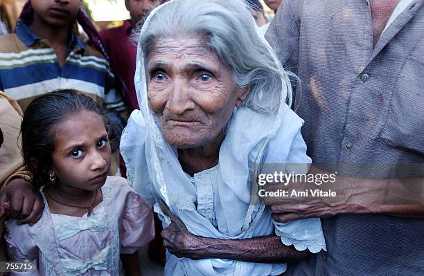 An elderly woman whose home was burned takes refuge along with more than 5000 other Muslims March 5, 2002 inside a mosque in central Ahmadabad,...