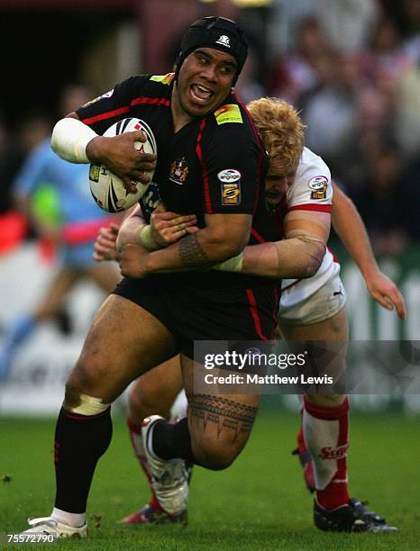 James Graham of St.Helens tackles Iafeta Palaeaaesina of Wigan during the engage Super League match between St.Helens and Wigan Warriors at Knowsley...