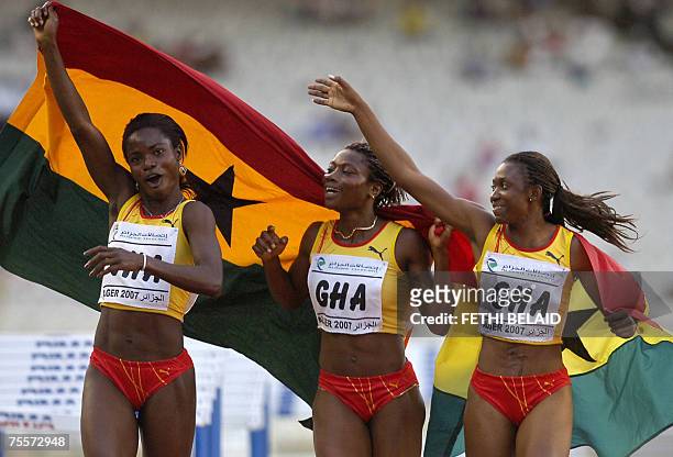 Ghana's Addy Gifty, Dankwah Esther and Vida Anim celebrate holding their national flag after they won gold medal 20 July 2007 in the Women's 4 x 100...