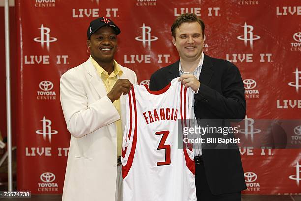 Steve Francis and Rockets GM Daryl Morey are all smiles during the press conference to announce that Francis has signed a free agent contract with...