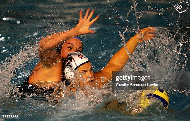 Christine Robinson of Canada goes after a ball against Heather Petri of the USA in the women's water polo finals during the XV Pan American Games at...