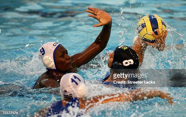 Yanelis Andreu of Cuba chases after Luiza Carvalho of Brazil in the women's water polo bronze medal game during the XV Pan American Games at Julio...