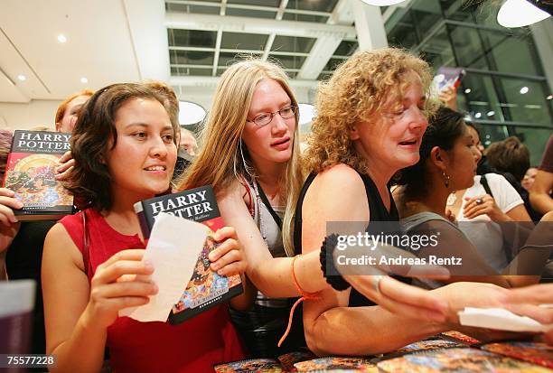 Fans await the last book by J.K. Rowling "Harry Potter and the Deathly Hallows" at a bookstore after its release at 1:01am on July 21, 2007 in...