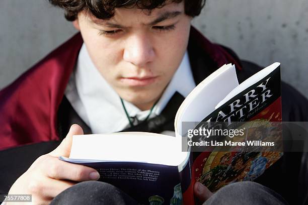 Harry Potter fan begins to read the final novel by author J.K. Rowling, "Harry Potter and the Deathly Hallows, at the much anticipated launch on July...