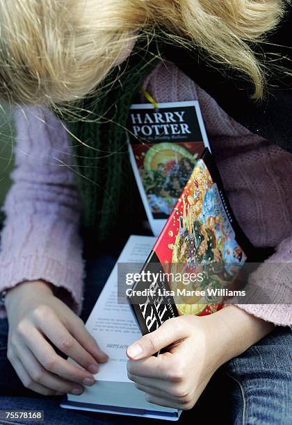 Harry Potter fan begins to read the final novel by author J.K. Rowling, "Harry Potter and the Deathly Hallows, at the much anticipated launch on July...