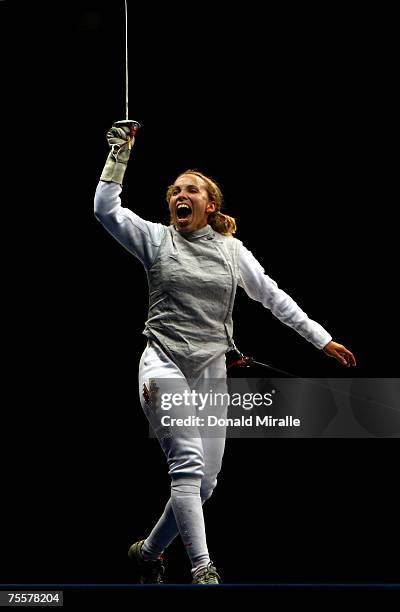 Mariana Gonzalez of Venezula celebrates her team's victory over Canada in the Gold Medal Final of the Women's Team Foil during the XV Pan American...