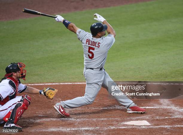 Albert Pujols of the St. Louis Cardinals follows through on a 4th inning home run against the Atlanta Braves at Turner Field on July 20, 2007 in...