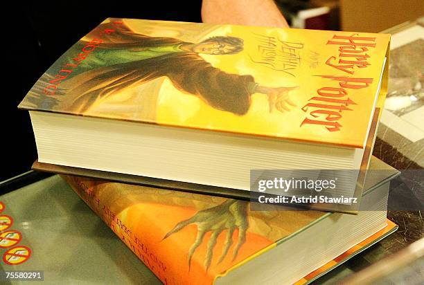 Excited Harry Potter fans celebrate the release of the book "Harry Potter And The Deathly Hallows" at Borders inside the Time Warner Center on July...